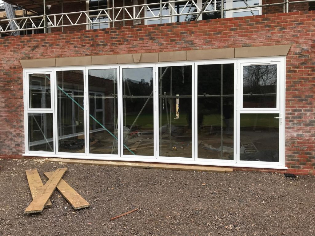 Aluminium Bifold Doors and Window Combination Installation Project in Enfield.